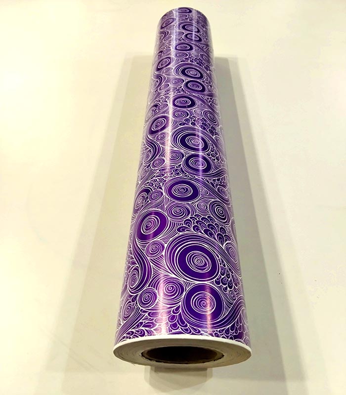 Papel de regalo morado con espirales 62 cm