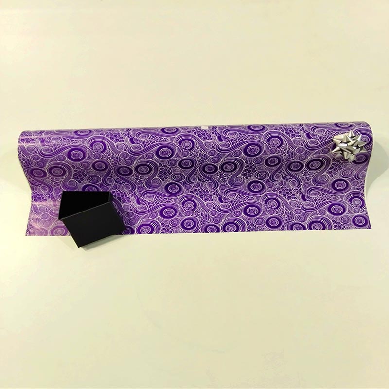 Papel de regalo morado con espirales 62 cm