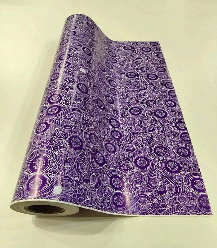 Papel de regalo morado con espirales 62 cm