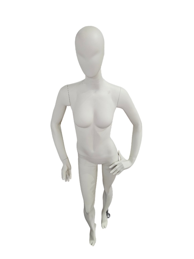 Female mannequin sitting in cream white