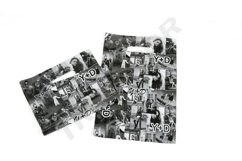 Plastic bags with die-cut handles 35X45 cm in black and white - 100 units